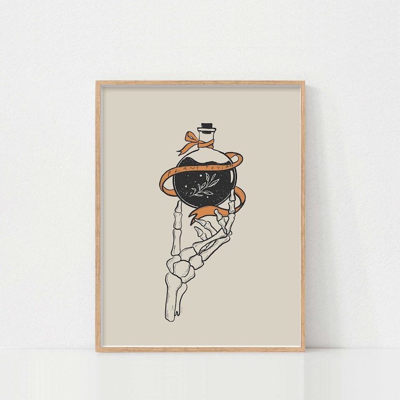 May include: A black and white illustration of a skeletal hand holding a glass bottle with a black liquid and a small plant inside. The bottle is tied with an orange ribbon that reads "Plant Potion".
