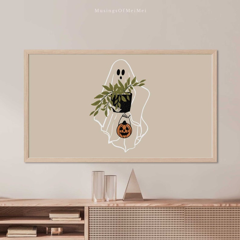 May include: A white ghost holding a potted plant and a small orange jack-o'-lantern. The ghost is outlined in white against a beige background.
