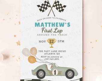 May include: A light-colored invitation with a race car theme. The text reads "MATTHEW'S First Lap Around the Track" with event details. Includes a vintage race car, checkered flags, balloons, and a trophy. The invitation is for a first birthday.