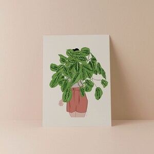 May include: Illustration of a person with a large green plant covering their head. The person is wearing a white top and coral shorts. The artwork is on a cream-coloured background.