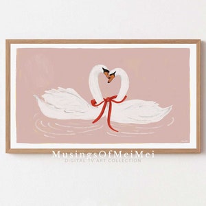 May include: Two white swans with red ribbon around their necks, facing each other, on a pink background.