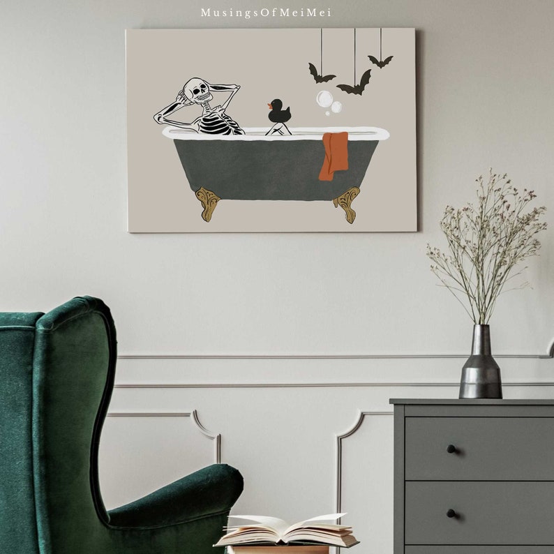 May include: A skeleton is relaxing in a bathtub with a rubber duck and a towel. Bats are hanging from the ceiling above the tub. The background is a light beige colour.
