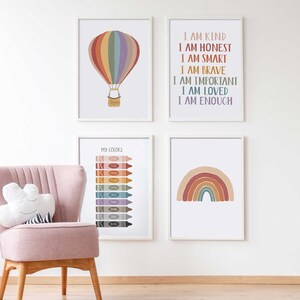 May include: Four framed prints with a rainbow theme. The top left print features a hot air balloon with rainbow stripes. The top right print has the text "I am kind, I am honest, I am smart, I am brave, I am important, I am loved, I am enough". The bottom left print has the text "My Colors" and shows a row of crayons in different colors. The bottom right print features a rainbow arch with a white background.