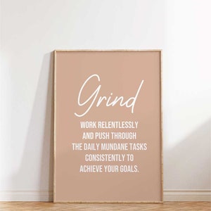 May include: A motivational poster with a peach background and white text that reads "Grind" and "Work relentlessly and push through the daily mundane tasks consistently to achieve your goals."