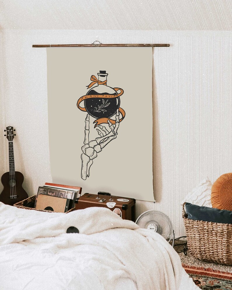 May include: A beige tapestry with a skeletal hand holding a glass bottle with a black liquid and a small sprig of leaves. The bottle is tied with a ribbon that reads "PLANT POISON".