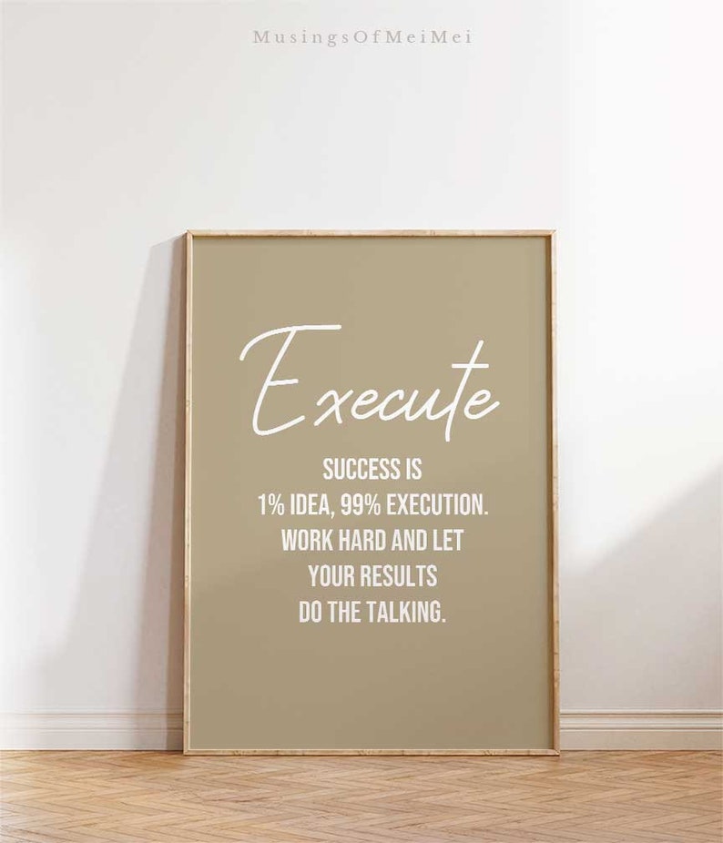 May include: A beige framed print with the text "Execute" in white cursive script. The text below reads "Success is 1% idea, 99% execution. Work hard and let your results do the talking."