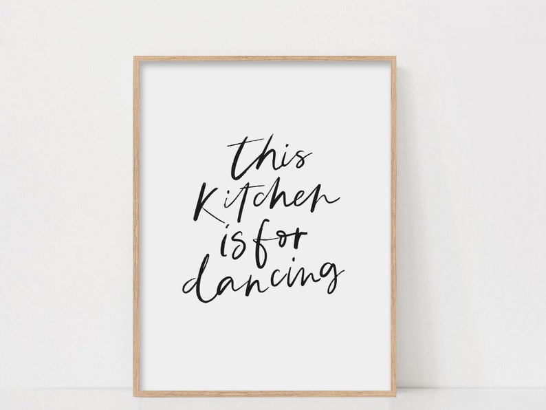 May include: A black and white printable wall art print with the text "This kitchen is for dancing".