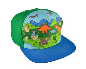 Cap with dinosaurs. Snapback cap for kids loving dinosaurs