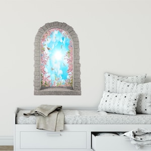 May include: A stone archway window decal with a view of a blue sky with white clouds and pink flowers. The decal is perfect for adding a touch of nature to any room.