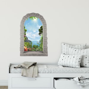 May include: A stone archway window decal with a view of a tropical island with lush green foliage, a blue sky, and a body of water.