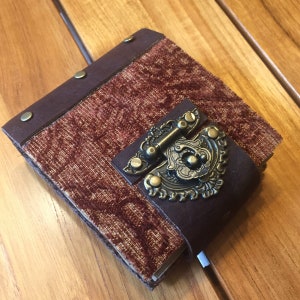 unique handmade journal vintage fabric, aged parchment, leather, bronze embellishments rust red