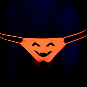 T back legals UV NEON Halloween pumpkin face orange black    stripper, thong, rave, club,  exotic, dance, panty, swim