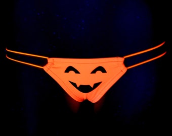T back legals UV NEON Halloween pumpkin face orange black    stripper, thong, rave, club,  exotic, dance, panty, swim
