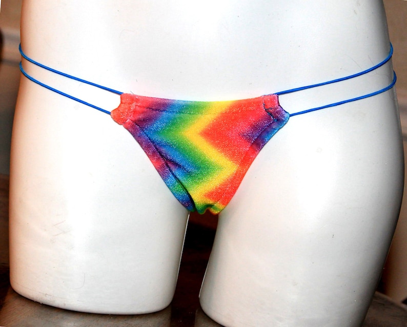 May include: Rainbow tie-dye thong underwear with blue elastic straps.