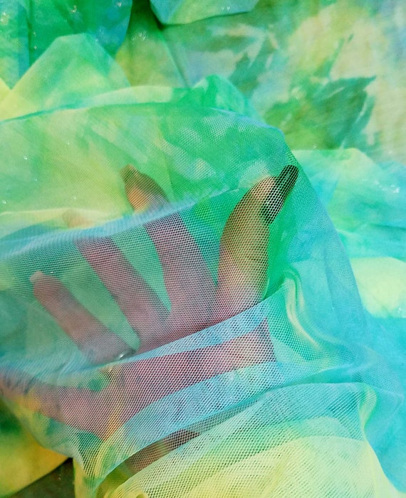 Fabric mesh neon green light medium blue  silver glitter shimmer   100 percent polyester mesh  56 inches wide sold by the  yard
