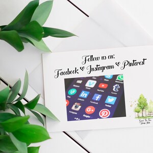 May include: White card with the text "Follow us on: Facebook &hearts; Instagram &hearts; Pinterest" and a photo of a smartphone screen displaying various social media app icons.