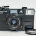 Very Rare Mamiya 135EF 35mm Film Rangefinder Camera with 38mm Mamiya-Sekor f/2.8 lens and manually controlled built-in flash.