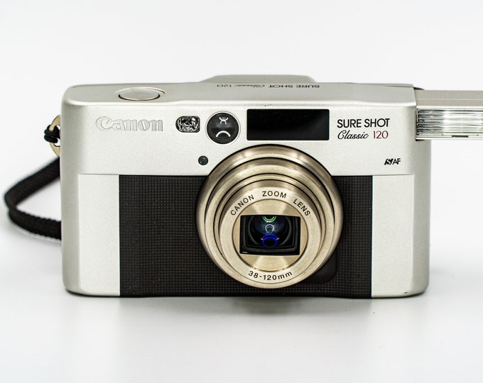 Canon SureShot Prima Classic Super 120 - 35mm Date Camera with 38-120mm Canon Lens. Comes with original leather case, box and manual