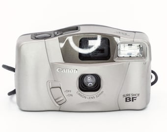 CANON Sure Shot BF. Point-and-shoot 35mm film camera with Big ViewFinder, Excellent for Lomography Style Photography. In perfect condition.