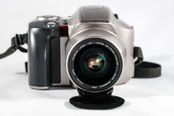 OLYMPUS IS-20/200 QuartzDate  All-in-One Camera with 28mm - 110mm Aspherical Lens.