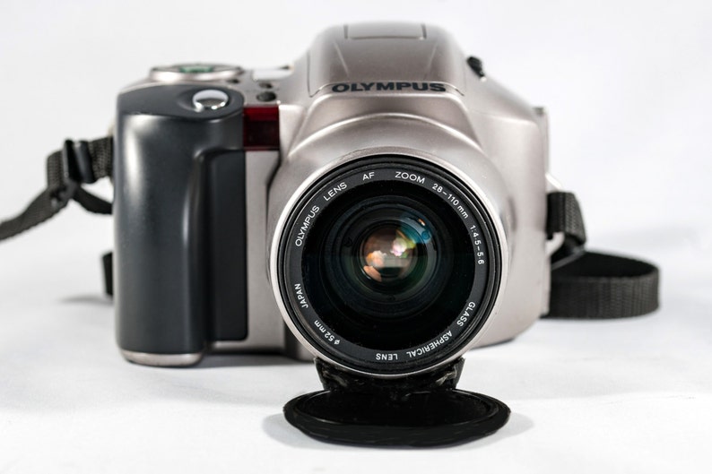 OLYMPUS IS-20200 QuartzDate All-in-One Camera with 28mm 110mm Aspherical Lens.