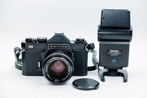 Excellent KODAK-CHINON cs SLR Camera, 55mm F1.7 lens, Vivitar External Flash, in genuine leather case. Like New!