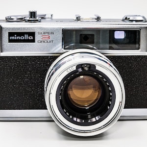 Minolta Hi-Matic 11 Rangefinder with Rokkor-PF 45mm f1.7 fast lens. In very good working condition!