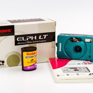 Canon ELPH LT IXUS M1 Ultra Compact Film Camera. Excellent camera in like new condition, with original box and manual