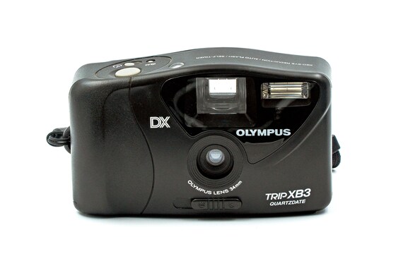 OLYMPUS TRIP XB3. Point-and-shoot 35mm film camera that needs to be in the pocket of any LOMO enthusiast. In perfect condition.