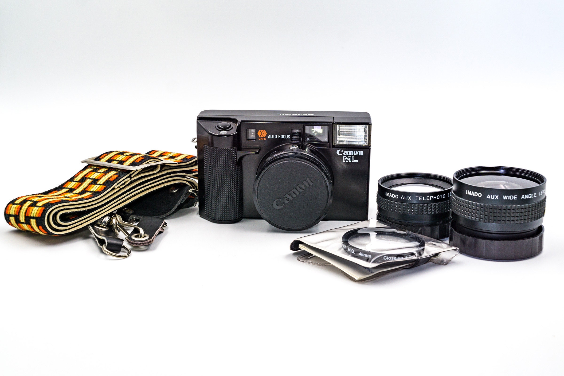 Canon AF35ML 35mm rangefinder film camera, with set of additional