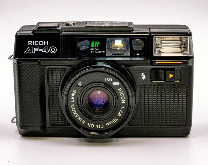 Ricoh AF-45 Autofocus Camera with Color Rikenon 38mm F2.8. Compact, elegant, pocket size beauty. Excellent condition.