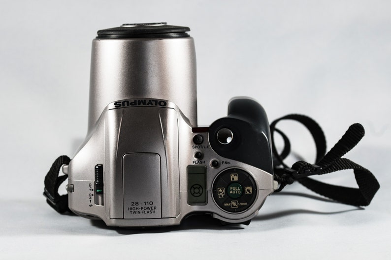 OLYMPUS IS-20200 QuartzDate All-in-One Camera with 28mm 110mm Aspherical Lens.