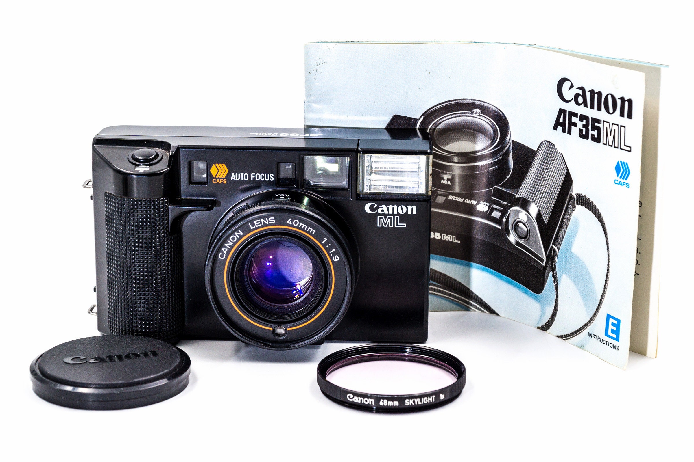 Canon AF35ML 35mm rangefinder film camera, with set of additional