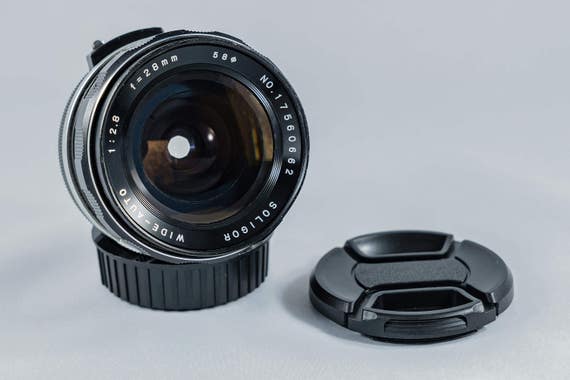 Tokina Soligor Wide-Auto 28 mm f/ 2.8 wide-angle fast prime lens for 35 mm SLR cameras. Canon FL/FD mount.  A+++ Condition