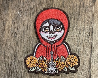 Miguel Bügelbild -PIxar, Jacke, Rucksack, Mütze, COCO 2026