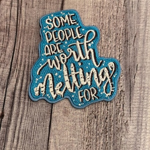 May include: A blue embroidered patch with white lettering that reads "Some people are worth letting for".
