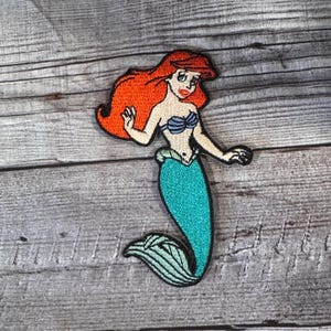 Ariel Bügelbild -PIxar, Flunder, Jacke, Rucksack, Hut, Prinzessin, Disney
