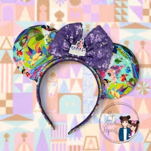 May include: Purple sequin Minnie Mouse ears with a colorful Disney park map design and a purple bow with a white castle charm. The ears are on a white and pastel background with a geometric pattern.
