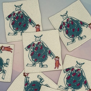 May include: Square embroidered patches with a cartoon monster design in teal and pink, holding hands with a smaller figure. The patches have a textured white background and are suitable for clothing or accessories.