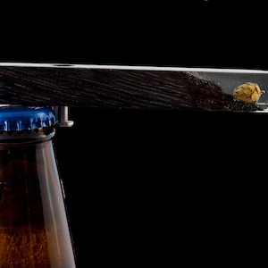 Bottle opener by MiliM. black