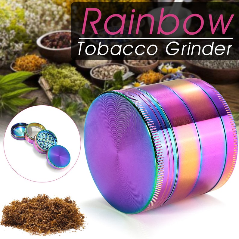 May include: A rainbow colored metal tobacco grinder with four parts. The grinder has a textured surface and a shiny finish. The grinder is on a white background.