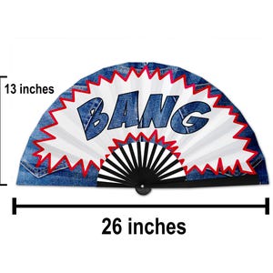 May include: A decorative fan with a denim-like background and the word "BANG" in blue letters. The fan is 26 inches wide and 13 inches high. The design includes a white burst with red jagged edges and a black and white fan base.