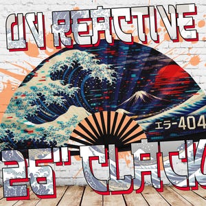 May include: A fan with a Japanese wave design, a red sun, and a mountain. The fan has the text "UN REACTIVE" and "25TH ATTACK" in a stylized font. The background is a white brick wall with orange paint splatters.