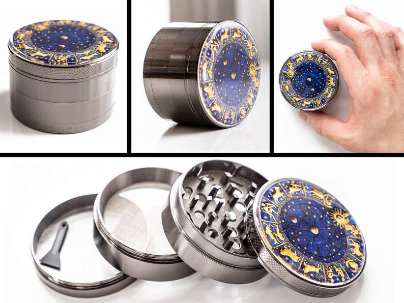 May include: A silver metal grinder with a blue and gold zodiac design. The grinder has four parts, including a top lid, a grinding chamber, a screen, and a bottom collection chamber.