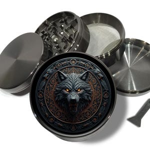 May include: A disassembled, metallic grinder with a detailed wolf design. The grinder features a lid, a grinding chamber, a mesh screen, and a bottom chamber. A small scraper is included.