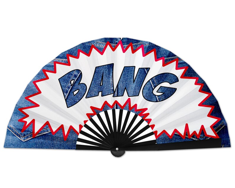 May include: A hand fan with a denim-like background and a white center featuring the word "BANG" in blue, outlined in black. The word is inside a red and white burst design. The fan's handle is black.