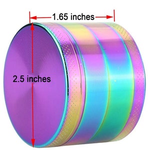May include: A 2.5 inch diameter, iridescent metal grinder with a 1.65 inch height. The grinder has a rainbow finish with a purple hue.