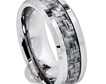 May include: A silver tungsten carbide ring with a black carbon fiber inlay. The ring has a beveled edge and a polished finish.