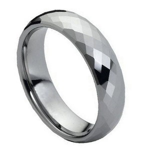 May include: A silver tungsten carbide ring with a faceted, diamond-cut design.