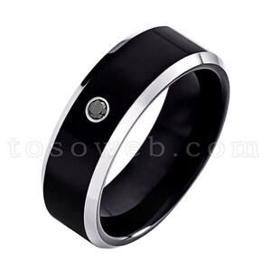 May include: A black tungsten carbide ring with a silver band and a single black diamond.
